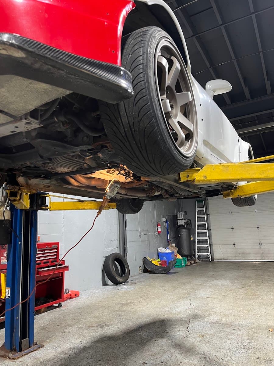 A car on the lift inside the Helonk Auto shop